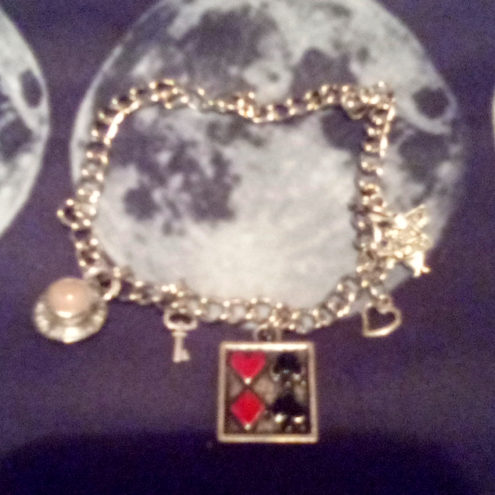 4/ $20 Alice in wonderland charm bracelet